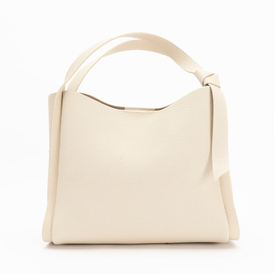 A beige leather bucket bag with a detachable shoulder strap and a front zipper closure.