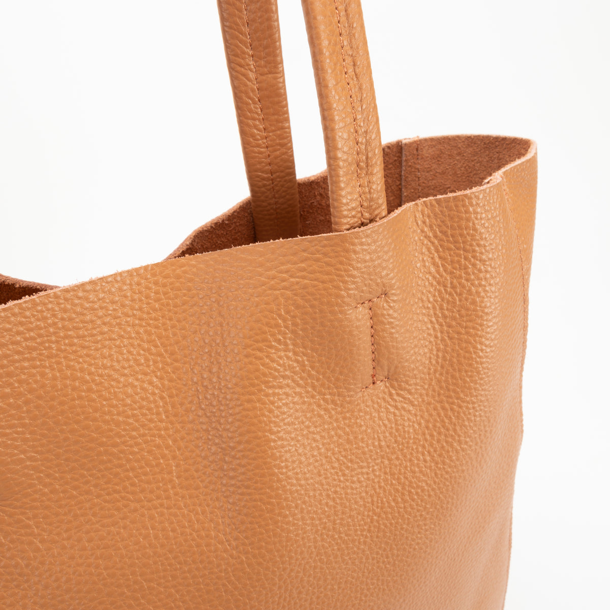 Close-up of soft tan leather on the Victoria Tote